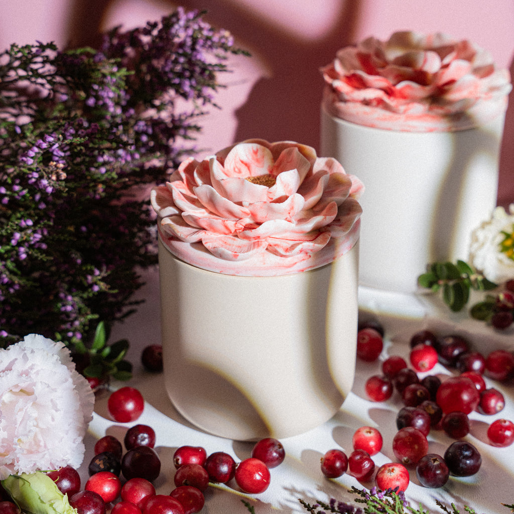 Elegant scented candle with tart cranberry and sweet vanilla aroma