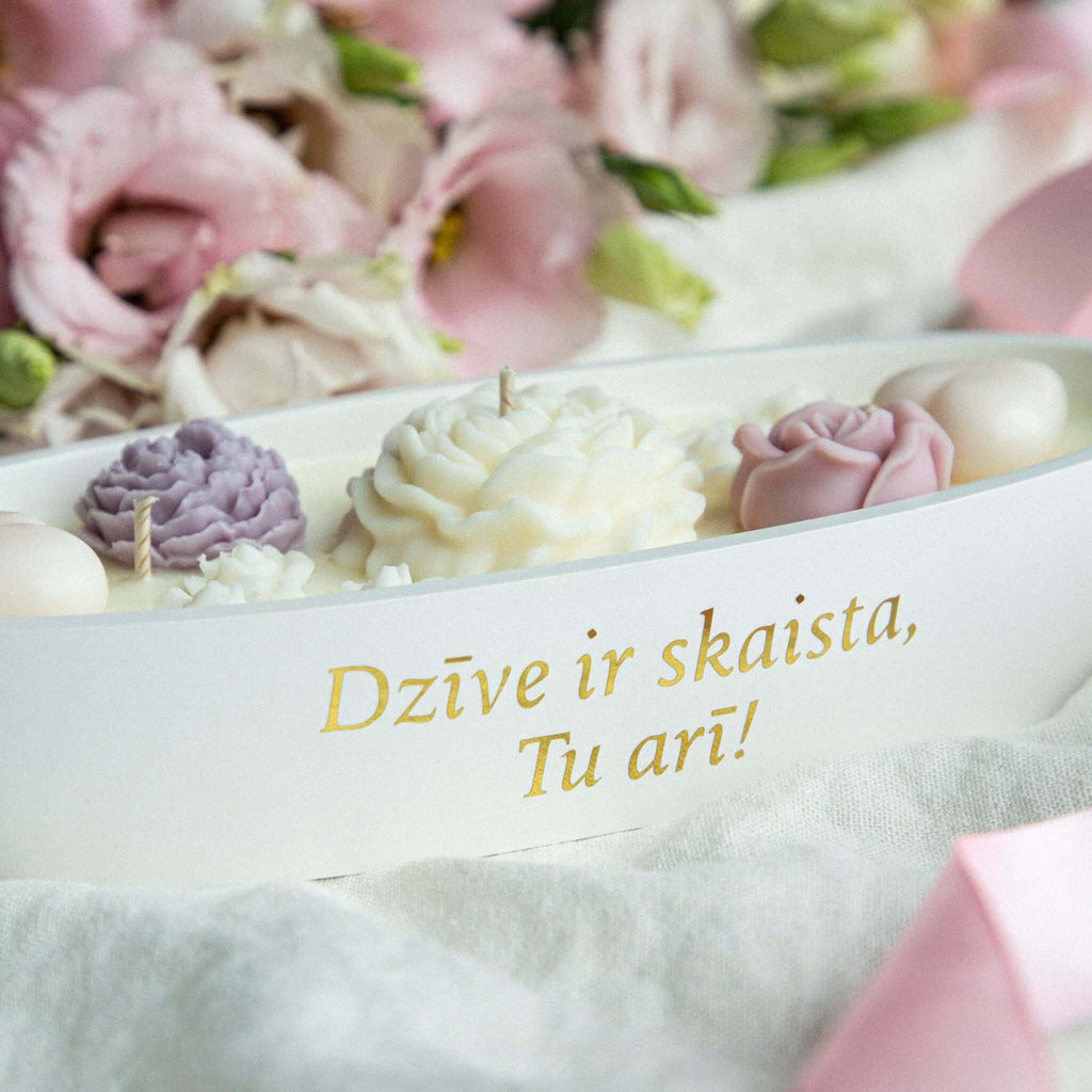 Pink and white floral soy wax candle, perfect for gifting loved ones